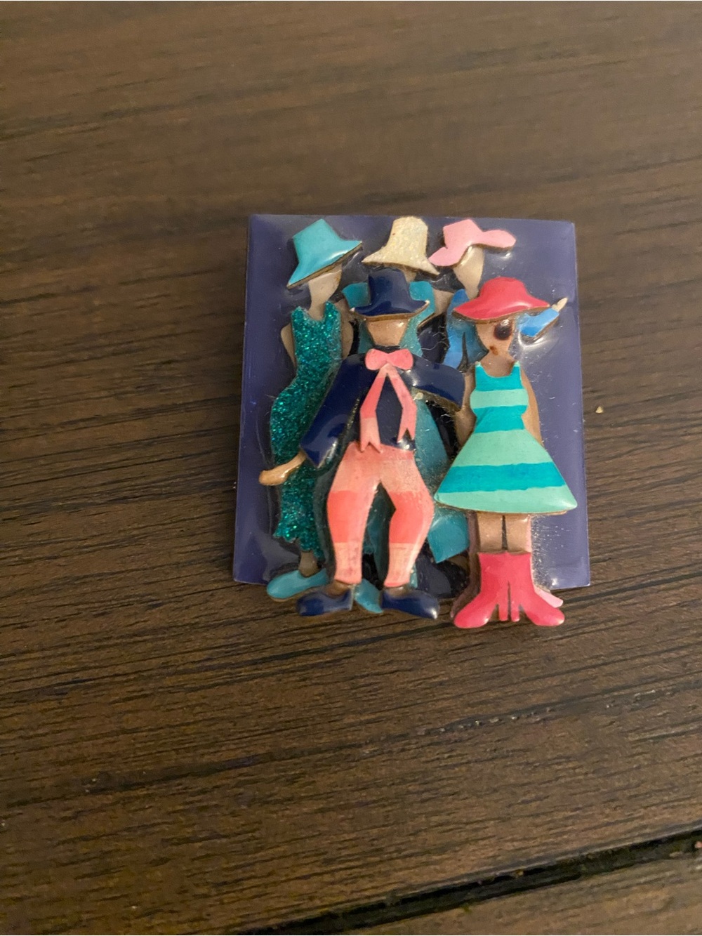 Women’s pin by Lucinda people in hats brooch.